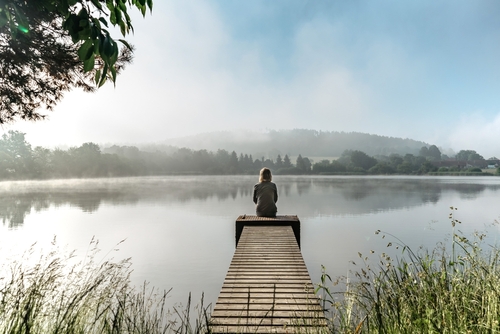 Calm morning meditation by pond